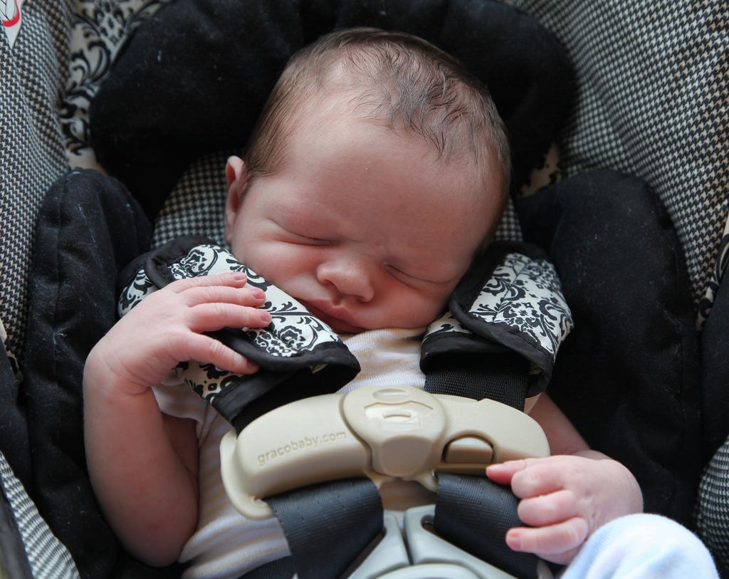Sleeping baby in a car seat